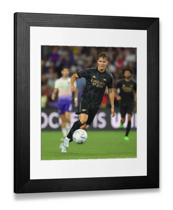 Framed Print : Martin Odegaard Leads Arsenal in Pre-Season Clash against Orlando City SC