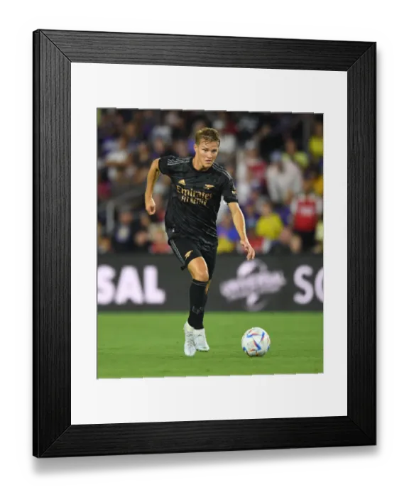 Framed Print : Martin Odegaard in Action: Arsenal vs Orlando City SC Pre-Season Clash at Exploria Stadium Framed Print : Martin Odegaard in Action: Arsenal vs Orlando City SC Pre-Season Clash at Exploria Stadium