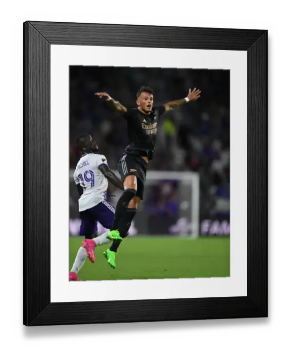Framed Print : Arsenal FC's Ben White Goes Head-to-Head with Orlando City SC in Pre-Season Friendly Framed Print : Arsenal FC's Ben White Goes Head-to-Head with Orlando City SC in Pre-Season Friendly
