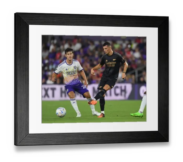 Framed Print : Granit Xhaka in Action: Arsenal's Pre-Season Battle at Orlando City SC