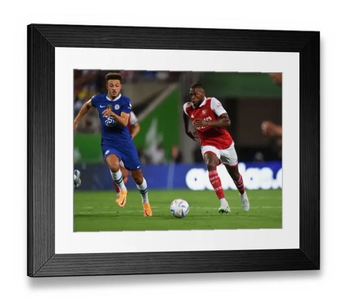 Framed Print : Arsenal's Nuno Tavares Outmaneuvers Chelsea's Ethan Ampadu in Florida Cup Clash