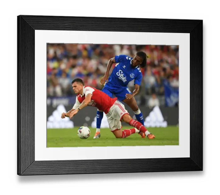 Framed Print : Arsenal vs. Everton: Xhaka Fouls Iwobi in Pre-Season Clash, Baltimore 2022 Framed Print : Arsenal vs. Everton: Xhaka Fouls Iwobi in Pre-Season Clash, Baltimore 2022
