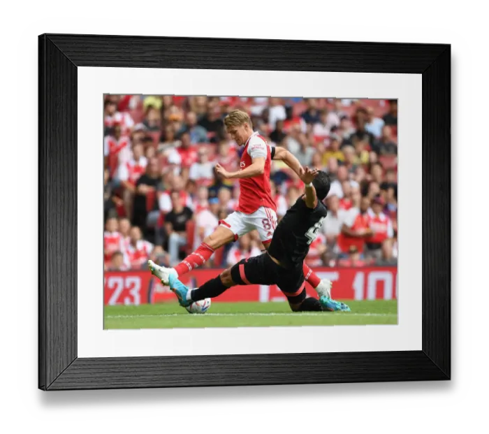 Framed Print : Arsenal vs Sevilla: Martin Odegaard Clashes with Karim Rekik in Emirates Cup 2022