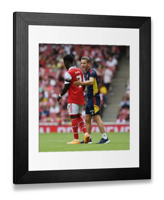 Framed Print : Arsenal's Bukayo Saka Training with Coach Albert Stuivenburg during Arsenal v Sevilla Emirates Cup 2022 Framed Print : Arsenal's Bukayo Saka Training with Coach Albert Stuivenburg during Arsenal v Sevilla Emirates Cup 2022