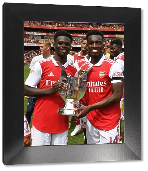 Arsenal's Bukayo Saka and Eddie Nketiah Lift Emirates Cup after Arsenal v Sevilla Pre-Season Friendly