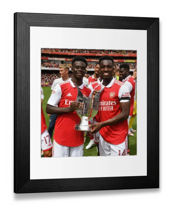 Framed Print : Arsenal's Bukayo Saka and Eddie Nketiah Lift Emirates Cup after Arsenal v Sevilla Pre-Season Friendly Framed Print : Arsenal's Bukayo Saka and Eddie Nketiah Lift Emirates Cup after Arsenal v Sevilla Pre-Season Friendly