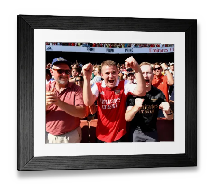 Framed Print : Arsenal Fans in Full Swing: Celebrating a Thrilling Victory over Leicester City, Premier League 2022-23