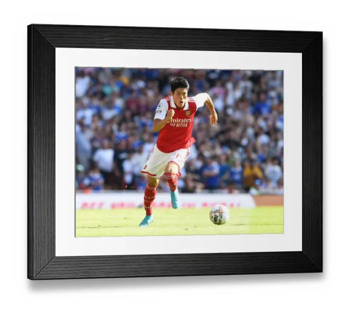 Framed Print : Arsenal's Tomiyasu in Action: Arsenal vs. Leicester City, Premier League 2022-23