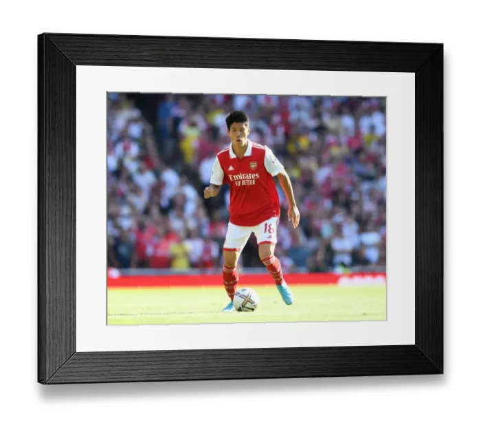 Framed Print : Arsenal's Tomiyasu in Action: Premier League 2022-23 - Arsenal vs. Leicester City