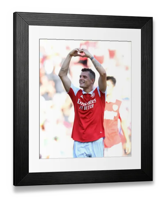 Framed Print : Granit Xhaka's Emotional Family Reunion: Arsenal's Win Against Leicester City (2022-23)