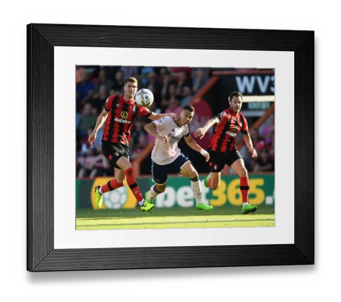 Framed Print : Martinelli Stands Firm: Arsenal Forward's Determined Showdown Against Mepham and Smith in AFC Bournemouth vs Arsenal, 2022-23 Premier League