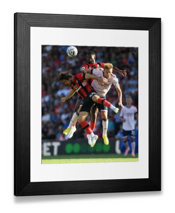 Framed Print : Clash at Vitality: Arsenal's Odegaard Faces Off Against Bournemouth's Pearson and Lerma