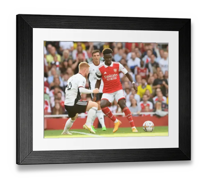 Framed Print : Arsenal's Bukayo Saka Fends Off Fulham's Harrison Reed in Premier League Clash Framed Print : Arsenal's Bukayo Saka Fends Off Fulham's Harrison Reed in Premier League Clash