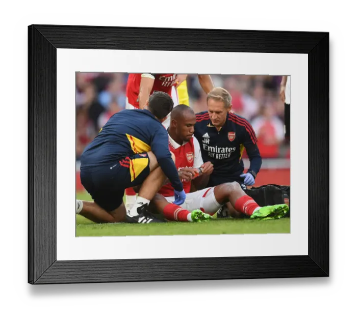 Framed Print : Arsenal's Gabriel Magalhaes Receives Treatment During Arsenal v Fulham Match, 2022-23 Premier League