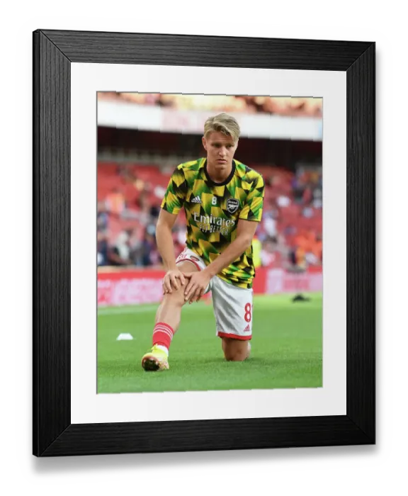Framed Print : Arsenal's Martin Odegaard Prepares for Arsenal v Aston Villa in 2022-23 Premier League