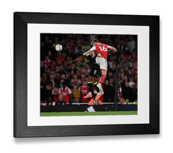 Framed Print : Arsenal vs Aston Villa: Rob Holding Wins Aerial Battle in 2022-23 Premier League Clash