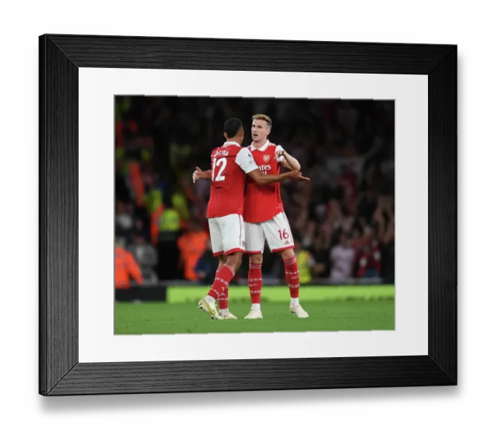 Framed Print : Arsenal's Holding and Saliba Celebrate Victory Over Aston Villa in 2022-23 Premier League