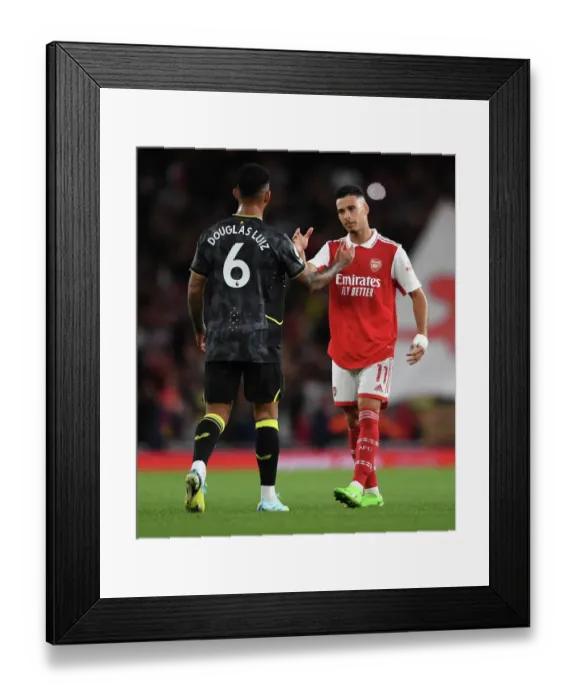 Framed Print : Arsenal's Martinelli and Luiz Share a Moment After Arsenal v Aston Villa Premier League Clash (2022-23) Framed Print : Arsenal's Martinelli and Luiz Share a Moment After Arsenal v Aston Villa Premier League Clash (2022-23)