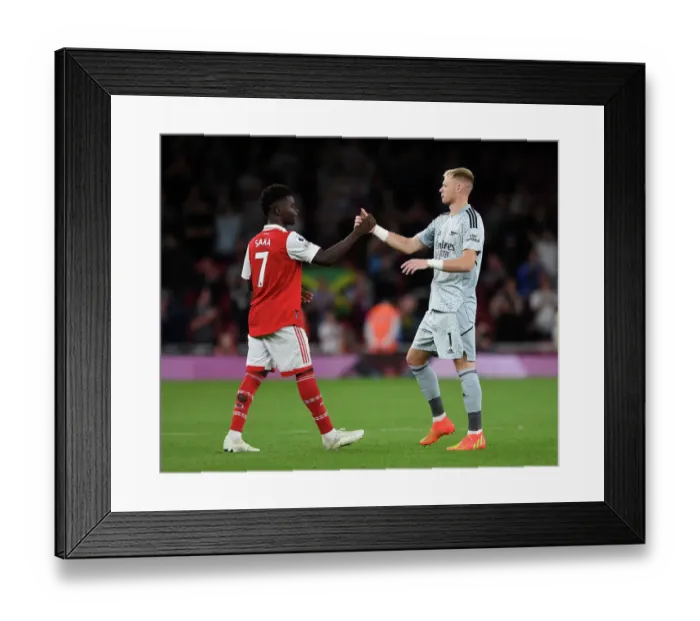 Framed Print : Arsenal's Saka and Ramsdale Celebrate Victory over Aston Villa in 2022-23 Premier League