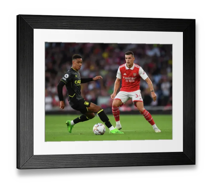 Framed Print : Arsenal's Xhaka Fends Off Villa's Ramsey: Premier League Clash at Emirates Stadium (August 2022)