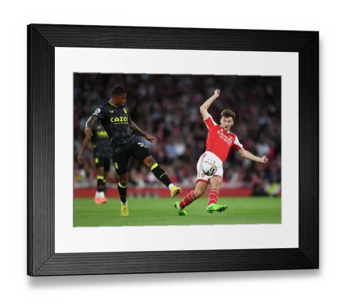 Framed Print : Arsenal's Kieran Tierney Fends Off Aston Villa's Leon Bailey During Premier League Clash at Emirates Stadium