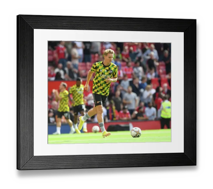 Framed Print : Arsenal's Martin Odegaard Prepares for Battle: Arsenal vs. Manchester United (2022-23 Premier League)