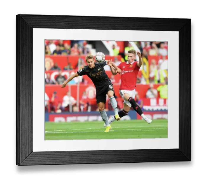 Framed Print : Clash of Midfield Titans: Odegaard vs McTominay - Manchester United vs Arsenal Premier League Showdown Framed Print : Clash of Midfield Titans: Odegaard vs McTominay - Manchester United vs Arsenal Premier League Showdown