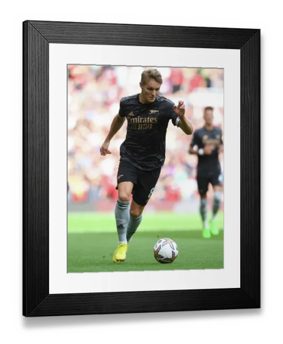 Framed Print : Martin Odegaard vs Manchester United: Arsenal's Midfield Maestro Clashes with Rivals in Premier League Showdown (2022-23)