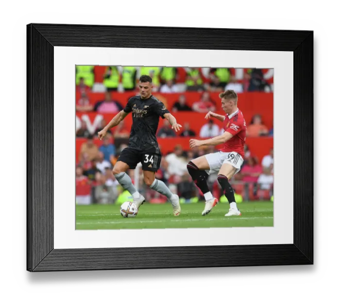 Framed Print : Clash of Midfield Titans: Xhaka vs. McTominay - Manchester United vs. Arsenal (2022-23) Framed Print : Clash of Midfield Titans: Xhaka vs. McTominay - Manchester United vs. Arsenal (2022-23)