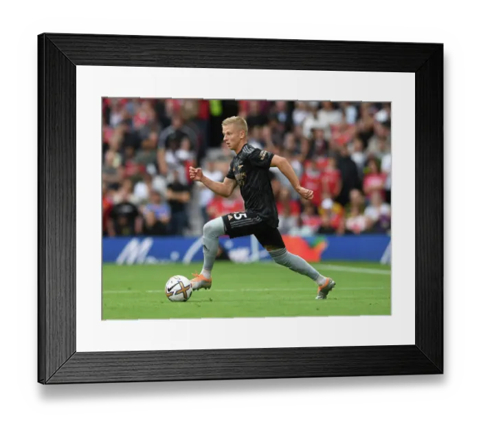Framed Print : Arsenal's Zinchenko Goes Head-to-Head with Manchester United in Premier League Showdown (2022-23)