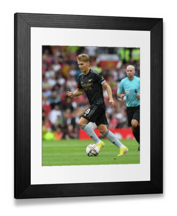 Framed Print : Odegaard vs Manchester United: A 2022-23 Premier League Battle at Old Trafford Framed Print : Odegaard vs Manchester United: A 2022-23 Premier League Battle at Old Trafford