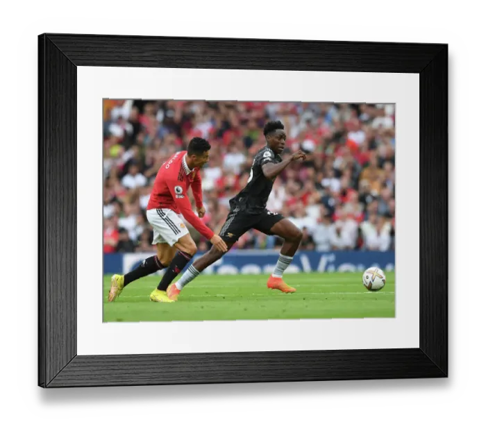 Framed Print : Clash of Titans: Lokonga vs. Ronaldo - Manchester United vs. Arsenal (Premier League 2022-23): A Battle of Stars at Old Trafford