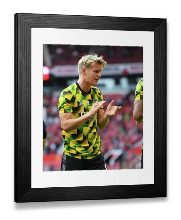 Framed Print : Arsenal's Martin Odegaard Gears Up for Manchester United Clash in Premier League (2022-23) Framed Print : Arsenal's Martin Odegaard Gears Up for Manchester United Clash in Premier League (2022-23)