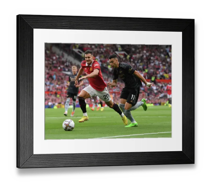 Framed Print : Martinelli vs Dalot: A Tense Battle in Manchester United vs Arsenal Premier League Clash (2022-23) Framed Print : Martinelli vs Dalot: A Tense Battle in Manchester United vs Arsenal Premier League Clash (2022-23)
