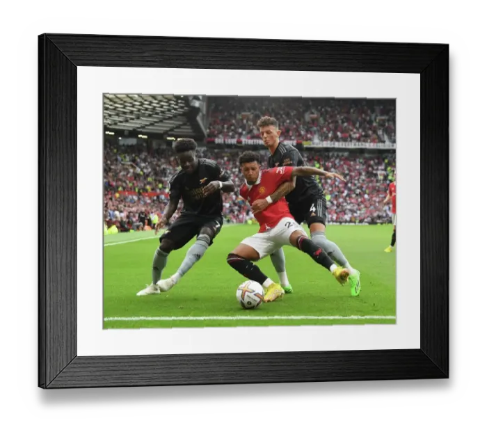 Framed Print : Manchester United vs. Arsenal: Bukayo Saka and Ben White Clash Against Jadon Sancho in 2022-23 Premier League Showdown