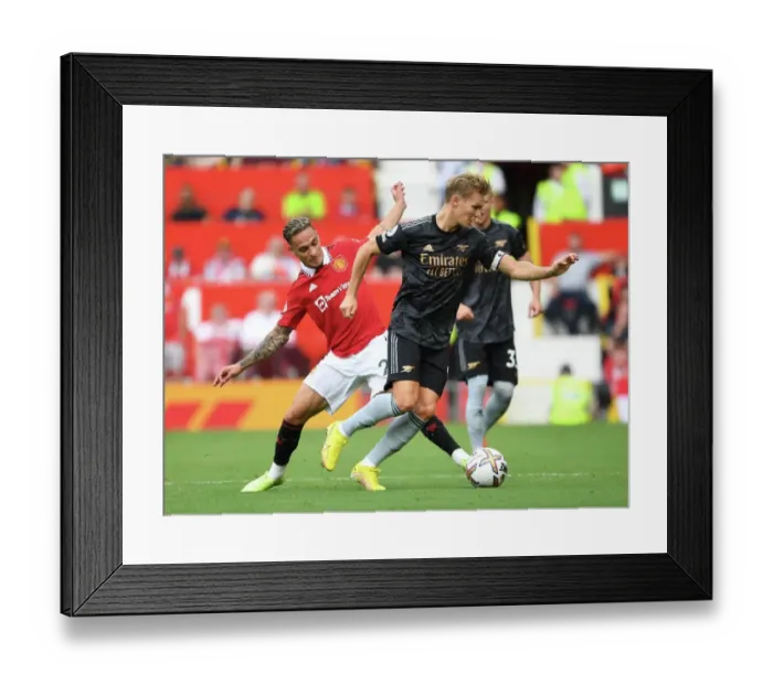 Framed Print : Clash of Stars: Odegaard vs. Antony - Premier League Showdown: Manchester United vs. Arsenal (2022-23) Framed Print : Clash of Stars: Odegaard vs. Antony - Premier League Showdown: Manchester United vs. Arsenal (2022-23)