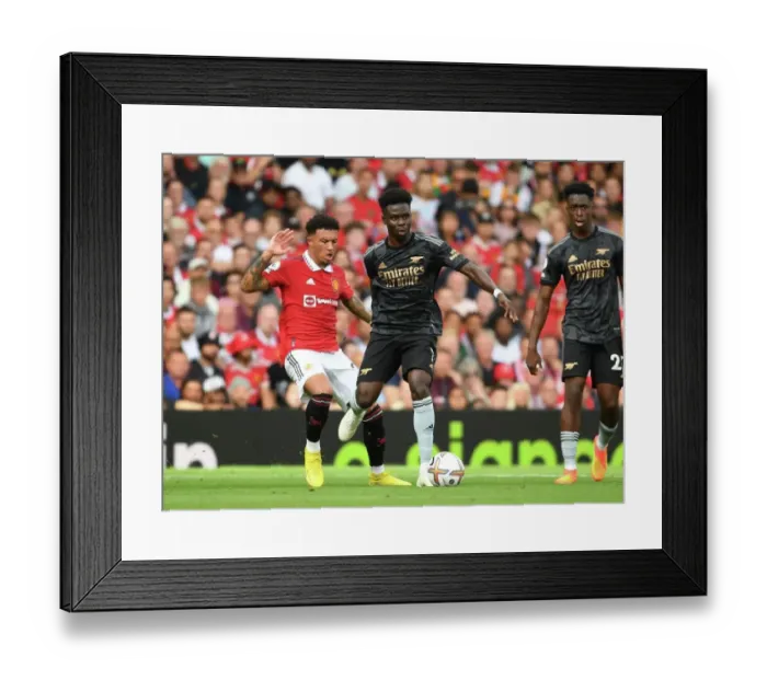 Framed Print : Saka Surges Past Sancho: Manchester United vs. Arsenal, Premier League 2022-23 Framed Print : Saka Surges Past Sancho: Manchester United vs. Arsenal, Premier League 2022-23
