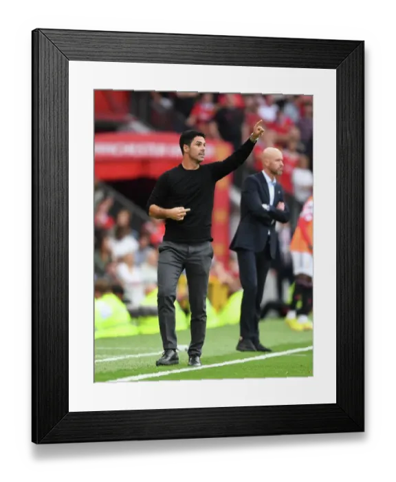 Framed Print : Arsenal's Mikel Arteta Faces Off Against Manchester United in Premier League Showdown (2022-23)