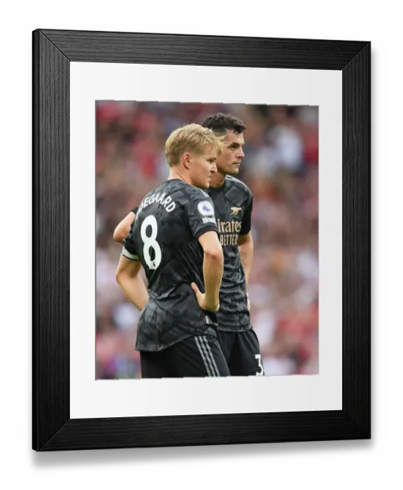 Framed Print : Manchester United vs Arsenal: Xhaka and Odegaard Face Off in Premier League Clash (2022-23) Framed Print : Manchester United vs Arsenal: Xhaka and Odegaard Face Off in Premier League Clash (2022-23)