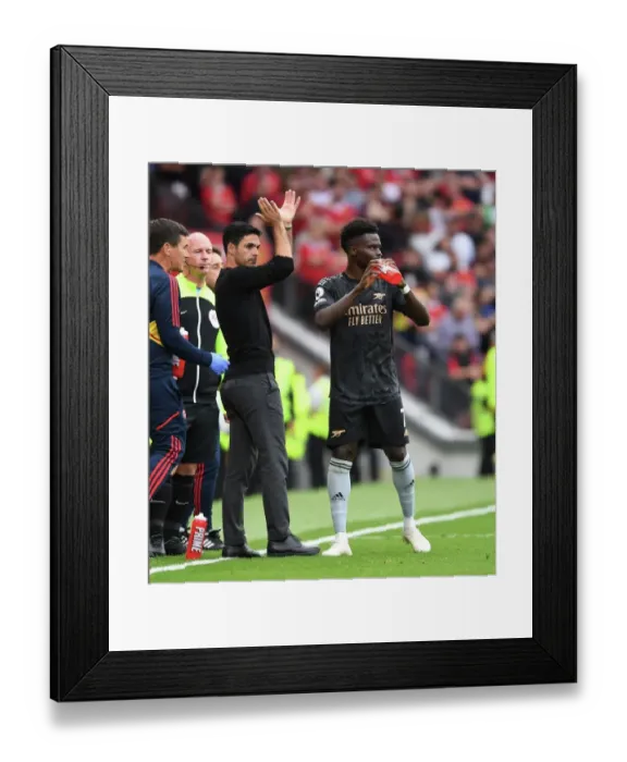 Framed Print : Arsenal Manager Mikel Arteta Guides Bukayo Saka at Manchester United's Old Trafford (Premier League 2022-23)