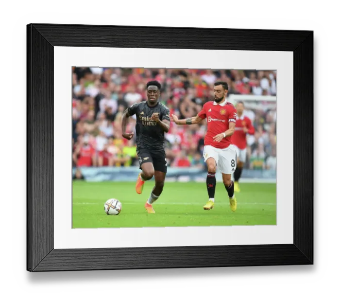 Framed Print : Sambi of Arsenal Outmaneuvers Bruno Fernandes in Manchester United vs. Arsenal FC Clash (2022-23 Premier League) Framed Print : Sambi of Arsenal Outmaneuvers Bruno Fernandes in Manchester United vs. Arsenal FC Clash (2022-23 Premier League)