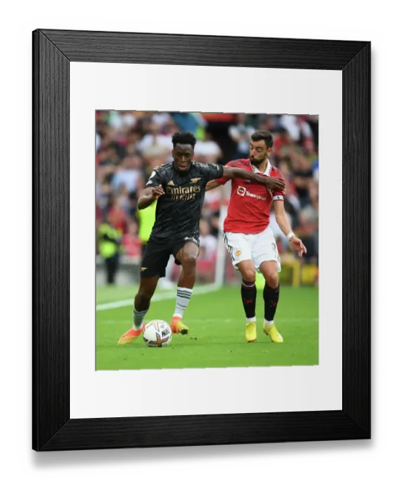 Framed Print : Sambi's Surge: Arsenal's Triumph over Manchester United as Sambi Outmaneuvers Bruno Fernandes in the 2022-23 Premier League