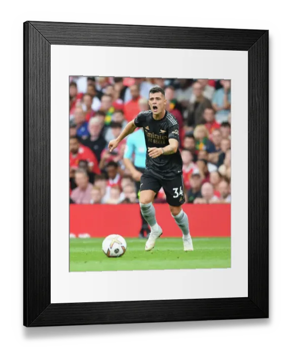 Framed Print : Granit Xhaka Faces Off at Old Trafford: Manchester United vs. Arsenal, 2022-23 Premier League Clash Framed Print : Granit Xhaka Faces Off at Old Trafford: Manchester United vs. Arsenal, 2022-23 Premier League Clash