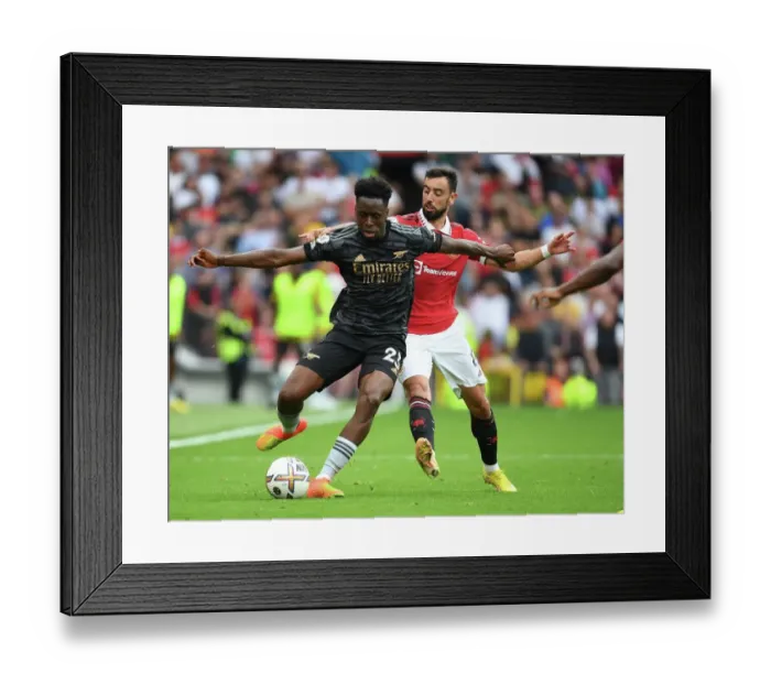 Framed Print : Sambi Outmaneuvers Bruno Fernandes: A Premier League Battle at Old Trafford, 2022-23 Framed Print : Sambi Outmaneuvers Bruno Fernandes: A Premier League Battle at Old Trafford, 2022-23