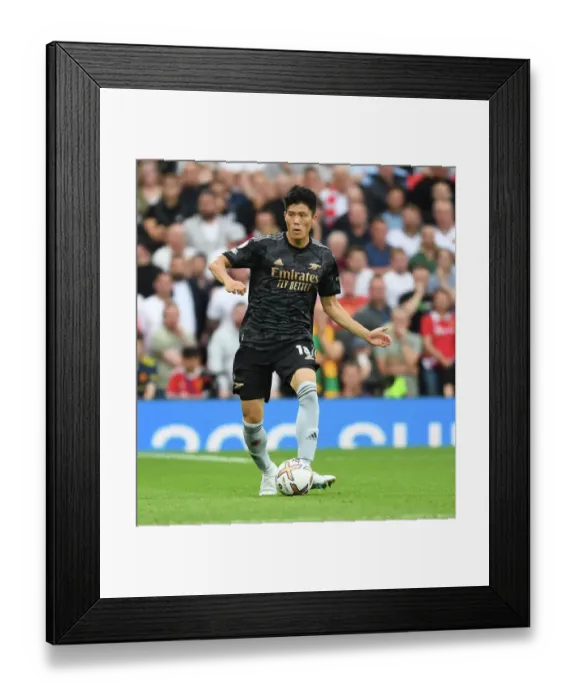 Framed Print : Tomiyasu Stands Firm Against Manchester United at Old Trafford (2022-23 Premier League)