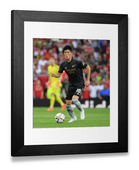 Framed Print : Tomiyasu Stands Firm: Arsenal's Defensive Hero at Old Trafford vs. Manchester United (2022-23 Premier League) Framed Print : Tomiyasu Stands Firm: Arsenal's Defensive Hero at Old Trafford vs. Manchester United (2022-23 Premier League)