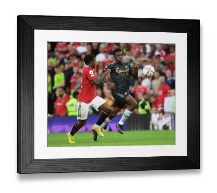 Framed Print : Manchester United vs Arsenal: Nketiah vs Malacia Clash in Premier League Showdown Framed Print : Manchester United vs Arsenal: Nketiah vs Malacia Clash in Premier League Showdown