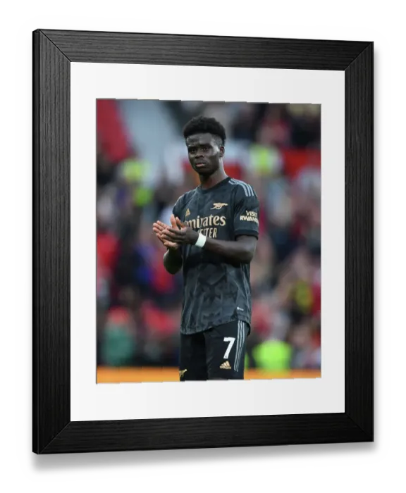 Framed Print : Saka Applauds Arsenal Fans: Manchester United vs Arsenal FC - Premier League 2022-23 Framed Print : Saka Applauds Arsenal Fans: Manchester United vs Arsenal FC - Premier League 2022-23