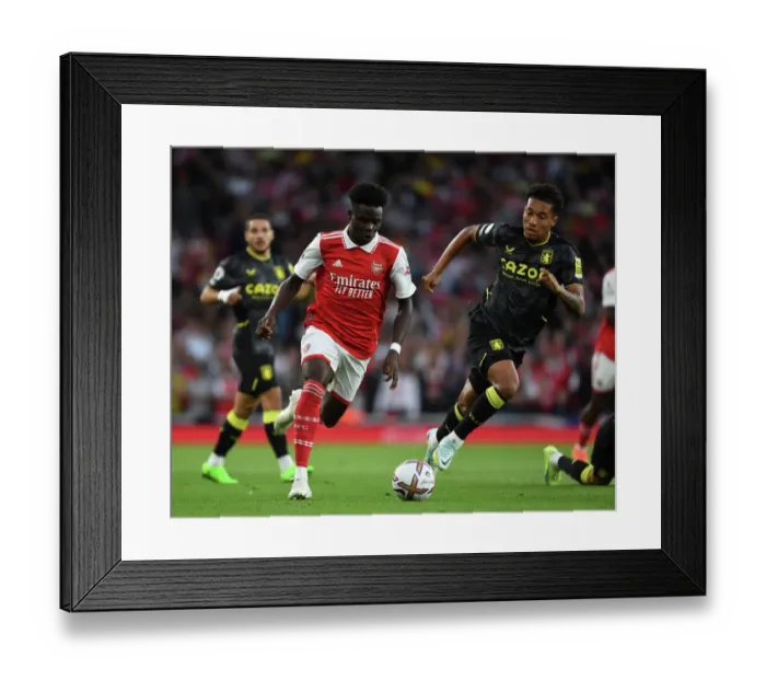 Framed Print : Arsenal's Bukayo Saka Clashes with Aston Villa's Jacob Ramsey in 2022-23 Premier League Showdown Framed Print : Arsenal's Bukayo Saka Clashes with Aston Villa's Jacob Ramsey in 2022-23 Premier League Showdown