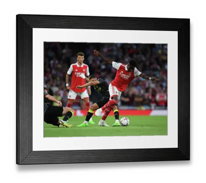 Framed Print : Arsenal's Bukayo Saka Outmaneuvers Aston Villa's Emiliano Buendia in Premier League Clash Framed Print : Arsenal's Bukayo Saka Outmaneuvers Aston Villa's Emiliano Buendia in Premier League Clash